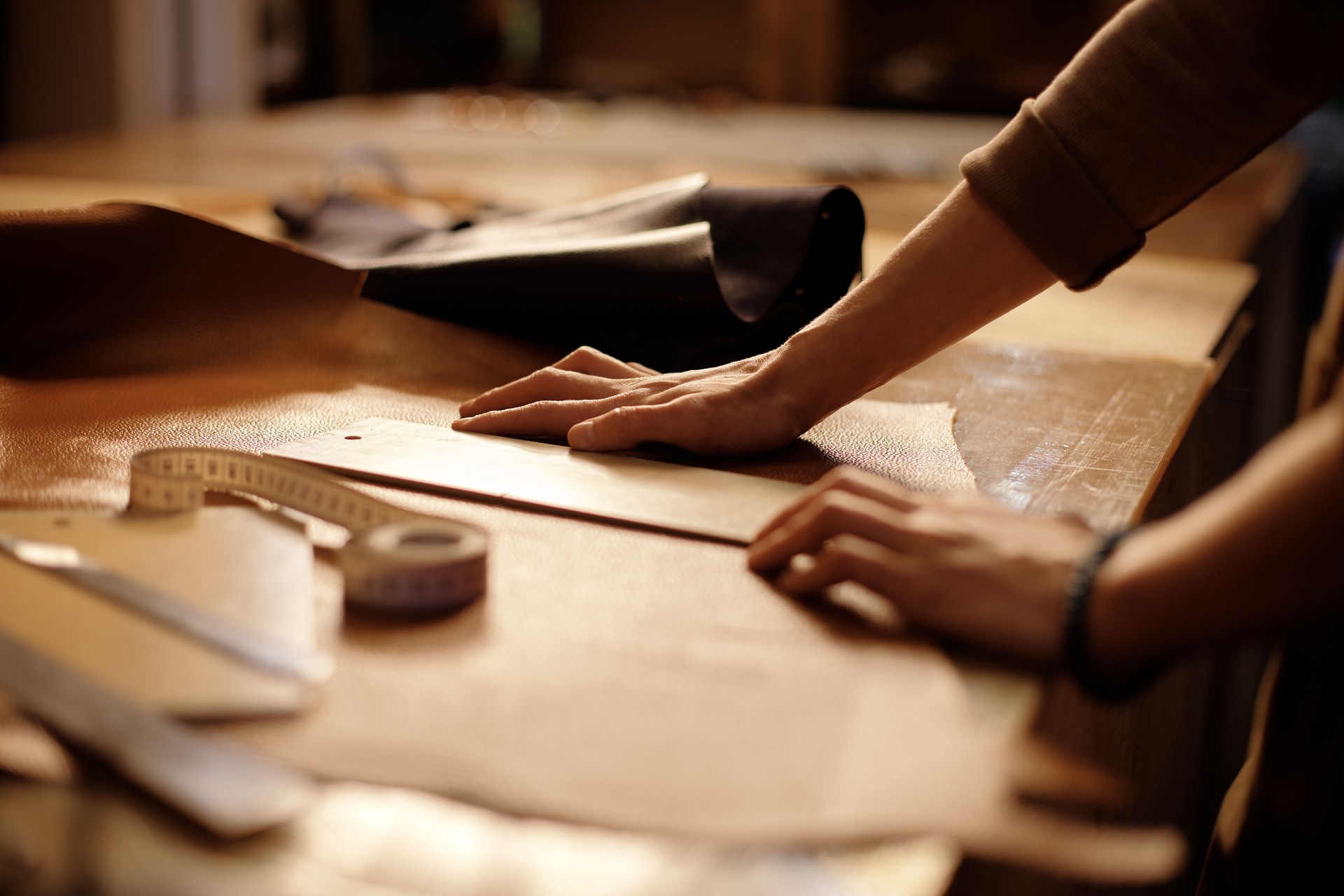 Crafting Leather Goods on Wooden Workbench